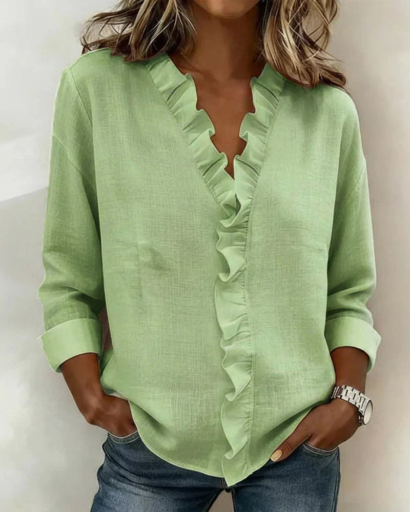 Clara Blusa con escote en V y volantes delicados